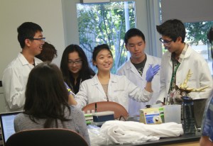 Students from the City of Hope practice their routine for the group video