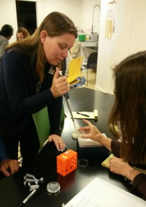Piner High teacher Heather Benson practices micropipetting.