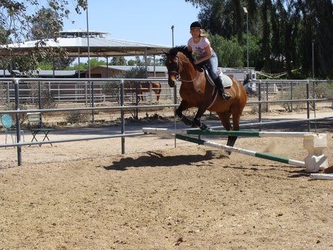 Kristin loves to ride horses.