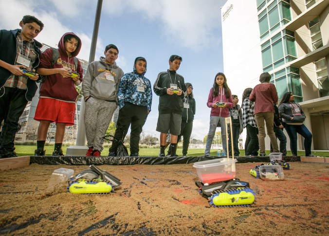 Students have fun with robots representing osteoblast and osteoclast cells at the Stem Cell Day of Discovery event held at the USC Health Sciences Campus in Los Angeles, CA. February 4th, 2017. The event encourages students to learn more about STEM opportunities, including stem cell study and biotech, and helps demystify the fields and encourage student engagement. Photo by David Sprague