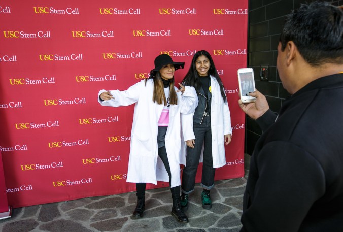 Genesis Archila, left, and Jasmine Archila get their picture taken at the Stem Cell Day of Discovery event held at the USC Health Sciences Campus in Los Angeles, CA. February 4th, 2017. The event encourages students to learn more about STEM opportunities, including stem cell study and biotech, and helps demystify the fields and encourage student engagement. Photo by David Sprague