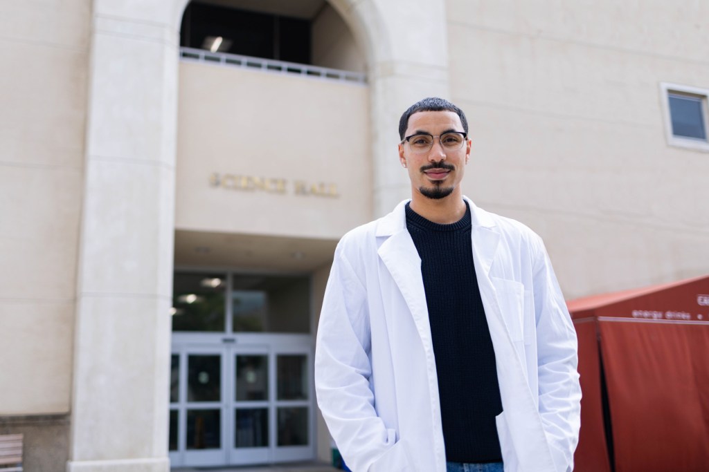 Image of Kevin Brown Jr. in a lab coat. 
