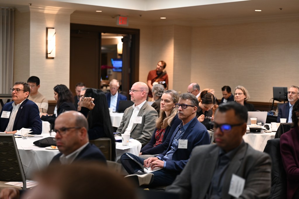 Attendees listening to a presentation at the CIRM Manufacturing Network Symposium.