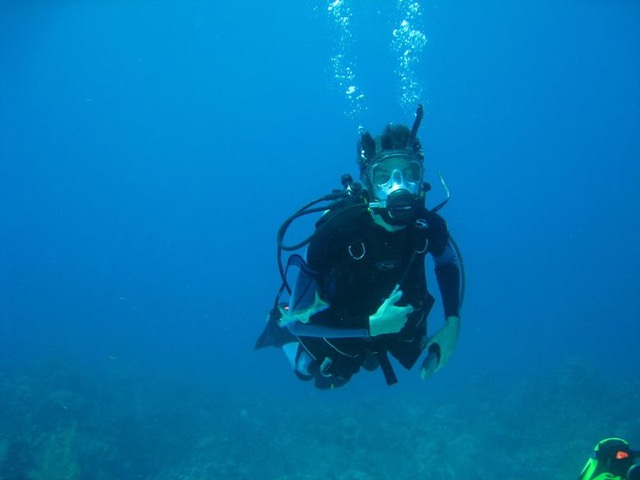 SCUBA diver giving a thumbs up under the water
